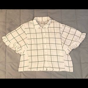 White blouse with green stripes.